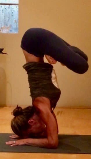 Elizabeth practicing Karandavasana - advanced arm balance from Intermediate Series